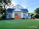 Lovely two-story home with a pristine lawn and cozy front porch at 6000 S Main St, Salisbury, NC 28147