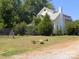 Lovely two-story home with mature landscaping on a well-maintained green lawn at 6000 S Main St, Salisbury, NC 28147