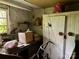 Cluttered interior space featuring storage cabinets, shelves, and various items at 6000 S Main St, Salisbury, NC 28147
