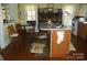 This kitchen features a fireplace, window, and island with a counter for seating at 6000 S Main St, Salisbury, NC 28147