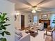 Cozy living room featuring a ceiling fan, built-in shelves, fireplace, and neutral-toned furniture for a relaxing atmosphere at 6000 S Main St, Salisbury, NC 28147