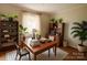 Well-lit office featuring plants, a large window, and desk at 6000 S Main St, Salisbury, NC 28147