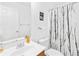 Bright bathroom featuring a clean vanity, toilet, and a shower with a decorative curtain at 6222 Ohaus Ct # 59, Charlotte, NC 28216