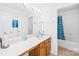Well-lit bathroom with a spacious vanity and a full-sized mirror, complemented by a shower-tub combination at 6222 Ohaus Ct # 59, Charlotte, NC 28216