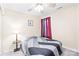 Cozy bedroom with a ceiling fan and large window for natural light, creating a peaceful retreat at 6222 Ohaus Ct # 59, Charlotte, NC 28216