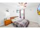Cozy bedroom with a ceiling fan and a large window for natural light, creating a peaceful retreat at 6222 Ohaus Ct # 59, Charlotte, NC 28216