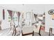 Bright dining room with glass table, elegant chandelier, and large windows offering a scenic view at 6222 Ohaus Ct # 59, Charlotte, NC 28216