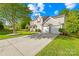 Beautiful two-story home with a well-maintained lawn and a spacious driveway leading to an attached two-car garage at 6222 Ohaus Ct # 59, Charlotte, NC 28216
