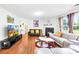 Inviting living room with hardwood floors, a fireplace, and neutral-toned decor, perfect for relaxation at 6222 Ohaus Ct # 59, Charlotte, NC 28216