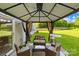Charming outdoor seating area with cushioned chairs and a gazebo, creating a relaxed and inviting space at 6222 Ohaus Ct # 59, Charlotte, NC 28216