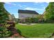 Spacious backyard with lush green grass and a fire pit, a serene oasis at 642 Vega Nw St, Concord, NC 28027