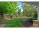 Beautiful backyard with lush green grass and mature trees at 642 Vega Nw St, Concord, NC 28027
