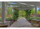 Stone path leads into the backyard with lush plants and manicured lawn at 642 Vega Nw St, Concord, NC 28027