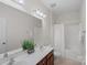 Bathroom with a double sink vanity, framed mirror, and shower-tub combination at 642 Vega Nw St, Concord, NC 28027