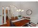 Elegant dining room with hardwood floors, chandelier, and staircase views at 642 Vega Nw St, Concord, NC 28027