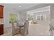 Bright dining area with large windows and seating for four at 642 Vega Nw St, Concord, NC 28027