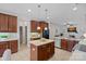 Spacious kitchen with center island, stainless steel appliances, and adjacent living area at 642 Vega Nw St, Concord, NC 28027