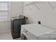 Convenient laundry room with washer, dryer, and overhead shelving at 642 Vega Nw St, Concord, NC 28027