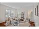 Bright living room with neutral tones, plush seating, and abundant natural light at 642 Vega Nw St, Concord, NC 28027