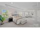 Bright main bedroom with sitting area, neutral decor, and large windows at 642 Vega Nw St, Concord, NC 28027