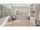 Sun-filled sitting area with neutral decor and large windows at 642 Vega Nw St, Concord, NC 28027
