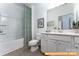 Functional bathroom featuring a single vanity, toilet, and bathtub with a shower at 6455 Honor Ave, Midland, NC 28107