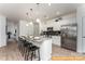 Modern kitchen featuring stainless steel appliances and a granite-topped island with seating at 6455 Honor Ave, Midland, NC 28107