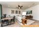 Open-concept living space with dining table and a comfortable seating area with lots of natural light at 6455 Honor Ave, Midland, NC 28107