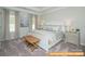 Comfortable main bedroom with a queen bed, soft linens, and natural light from the windows at 6455 Honor Ave, Midland, NC 28107