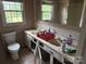 Bathroom featuring double vanity with natural light from the window at 6482 Taylorsville E Hwy, Hiddenite, NC 28636