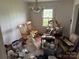Bedroom with hardwood flooring and bright window overlooking the yard at 6482 Taylorsville E Hwy, Hiddenite, NC 28636