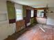 Spacious living area featuring hardwood floors and multiple windows at 6482 Taylorsville E Hwy, Hiddenite, NC 28636