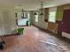 Spacious living area featuring hardwood floors and multiple windows and doorway at 6482 Taylorsville E Hwy, Hiddenite, NC 28636