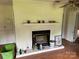Living room with a fireplace and a light-colored wall at 6482 Taylorsville E Hwy, Hiddenite, NC 28636