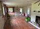 Bright living area with hardwood floors, a fireplace, and natural lighting at 6482 Taylorsville E Hwy, Hiddenite, NC 28636