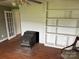 Cozy living area featuring hardwood floors and a brick fireplace at 6482 Taylorsville E Hwy, Hiddenite, NC 28636