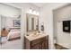 Bathroom with a vanity and a glimpse into the bedroom at 6617 Wannamaker Ln, Charlotte, NC 28226