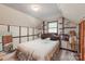 Well-lit bedroom with window, built-in storage and shelves, plus warm vintage accents at 6617 Wannamaker Ln, Charlotte, NC 28226