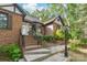 Charming brick home featuring a welcoming front entrance with brick steps and landscaping at 6617 Wannamaker Ln, Charlotte, NC 28226