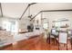 Open concept living room with hardwood floors, vaulted ceilings and a fireplace at 6617 Wannamaker Ln, Charlotte, NC 28226
