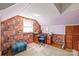 Attic office featuring geometric wallpaper, plush carpet, and custom radiator cover at 6617 Wannamaker Ln, Charlotte, NC 28226