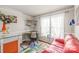 Cozy office space with natural light, bright colorful accents, and hardwood floors at 6617 Wannamaker Ln, Charlotte, NC 28226