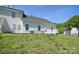Lovely view of a manicured lawn and white siding at 6631 Vlosi Dr, Charlotte, NC 28226