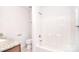 A full bathroom with a white tub, toilet, and wood vanity with granite countertop at 6631 Vlosi Dr, Charlotte, NC 28226