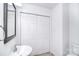 Well-lit bathroom with a large vanity, sink, and double-door closet for ample storage at 6631 Vlosi Dr, Charlotte, NC 28226