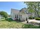 Well-maintained townhome with a manicured lawn and an attached one-car garage at 6631 Vlosi Dr, Charlotte, NC 28226