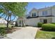 Two-story townhome with attached garage and a well-maintained lawn in a neighborhood at 6631 Vlosi Dr, Charlotte, NC 28226