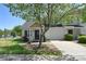Charming townhome featuring a well-maintained yard and an attached one car garage at 6631 Vlosi Dr, Charlotte, NC 28226