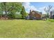 Brick home featuring a spacious backyard, perfect for outdoor activities at 709 Myrtle Dr, Rock Hill, SC 29730