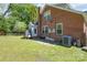Brick home with a charming back patio and well-maintained backyard at 709 Myrtle Dr, Rock Hill, SC 29730